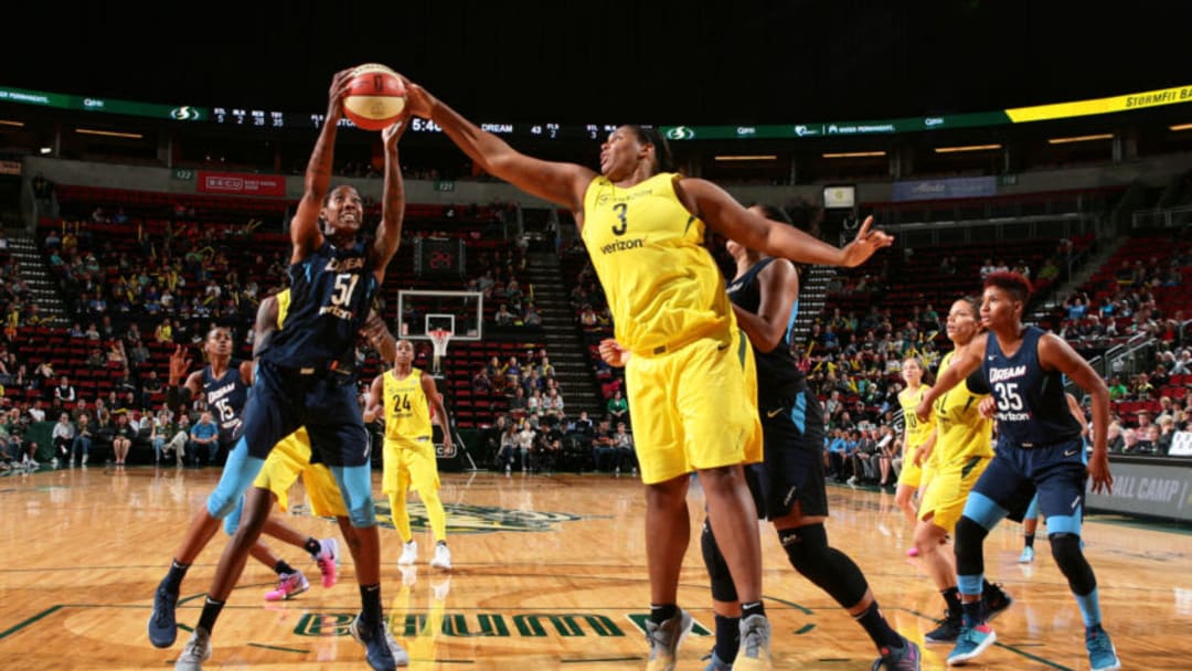 SEATTLE, WA - JUNE 10: Jessica Breland #51 of the Atlanta Dream handles the ball against Courtney Paris #3 of the Seattle Storm during the game on June 10, 2018 at KeyArena in Seattle, Washington. NOTE TO USER: User expressly acknowledges and agrees that, by downloading and/or using this Photograph, user is consenting to the terms and conditions of Getty Images License Agreement. Mandatory Copyright Notice: Copyright 2018 NBAE (Photo by Joshua Huston/NBAE via Getty Images)