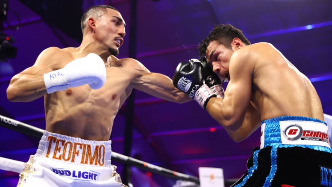 LAS VEGAS, NEVADA - AUGUST 13: Teofimo Lopez (L) and Pedro Campa (R) exchange punches during their NABF & WBO International junior welterweight fight at Resorts World Las Vegas on August 13, 2022 in Las Vegas, Nevada. (Photo by Mikey Williams/Top Rank Inc via Getty Images)