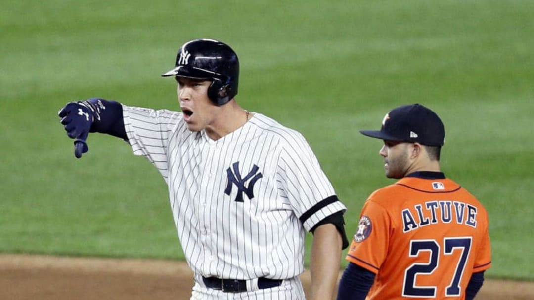 NEW YORK, NY - OCTOBER 17: Aaron Judge #99 of the New York Yankees celebrates his RBI double at second base as Jose Altuve #27 of the Houston Astros looks back in the eighth inning of Game Four of the American League Championship Series on October 17, 2017 at Yankee Stadium in the Bronx borough of New York City. Yankees won 6-4. (Photo by Paul Bereswill/Getty Images)