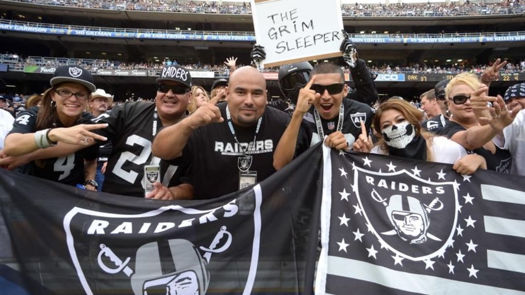 Oct 25, 2015; San Diego, CA, USA; Oakland Raiders fans cheer during the fourth quarter against the San Diego Chargers at Qualcomm Stadium. Mandatory Credit: Jake Roth-USA TODAY Sports