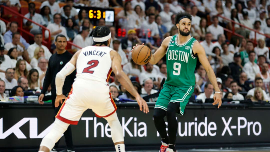 May 23, 2023; Miami, Florida, USA; Boston Celtics guard Derrick White (9) controls the ball against Miami Heat guard Gabe Vincent (2) in the third quarter during game four of the Eastern Conference Finals for the 2023 NBA playoffs at Kaseya Center. Mandatory Credit: Sam Navarro-USA TODAY Sports