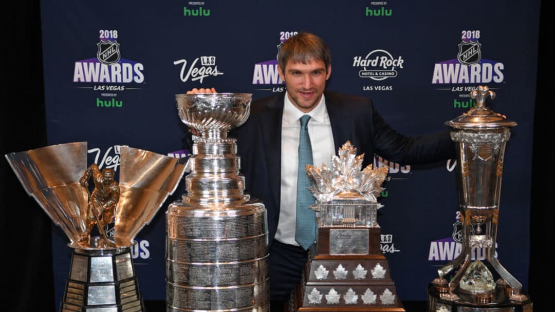 Jun 20, 2018; Las Vegas, NV, USA; Alexander Ovechkin is pictured with the Rocket Richard trophy, the Stanley Cup, the Conn Smythe, and the Wales trophy during the 2018 NHL Awards at Hard Rock Hotel and Casino. Mandatory Credit: Stephen R. Sylvanie-USA TODAY Sports