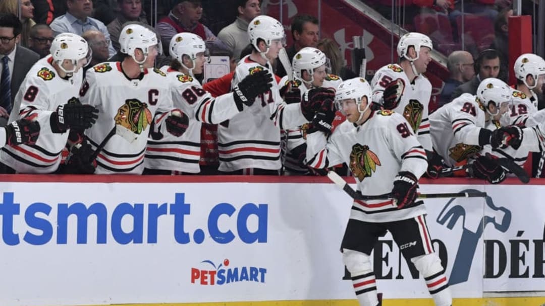 MONTREAL, QC - JANUARY 15: Drake Caggiula #91 of the Chicago Blackhawks celebrates with the bench after scoring a goal against the Montreal Canadiens in the NHL game at the Bell Centre on January 15, 2020 in Montreal, Quebec, Canada. (Photo by Francois Lacasse/NHLI via Getty Images)