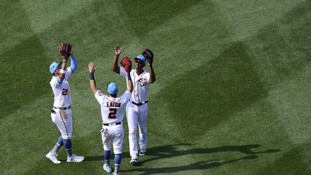 WASHINGTON, DC - JUNE 16: Juan Soto #22, Adam Eaton #2, and Michael A. Taylor #3 of the Washington Nationals celebrate after the Nationals defeated the Arizona Diamondbacks 15-5 at Nationals Park on June 16, 2019 in Washington, DC. (Photo by Patrick McDermott/Getty Images)