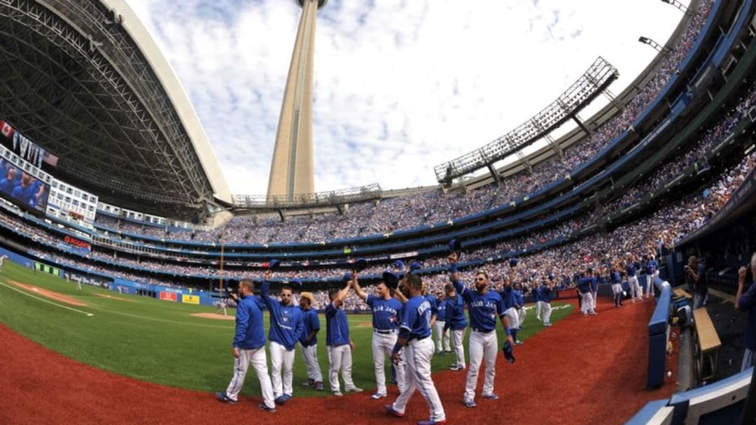Sep 27, 2015; Toronto, Ontario, CAN; Toronto Blue Jays players salute fans in the third inning of their final regular season home game against Tampa Bay Rays at Rogers Centre. Mandatory Credit: Dan Hamilton-USA TODAY Sports