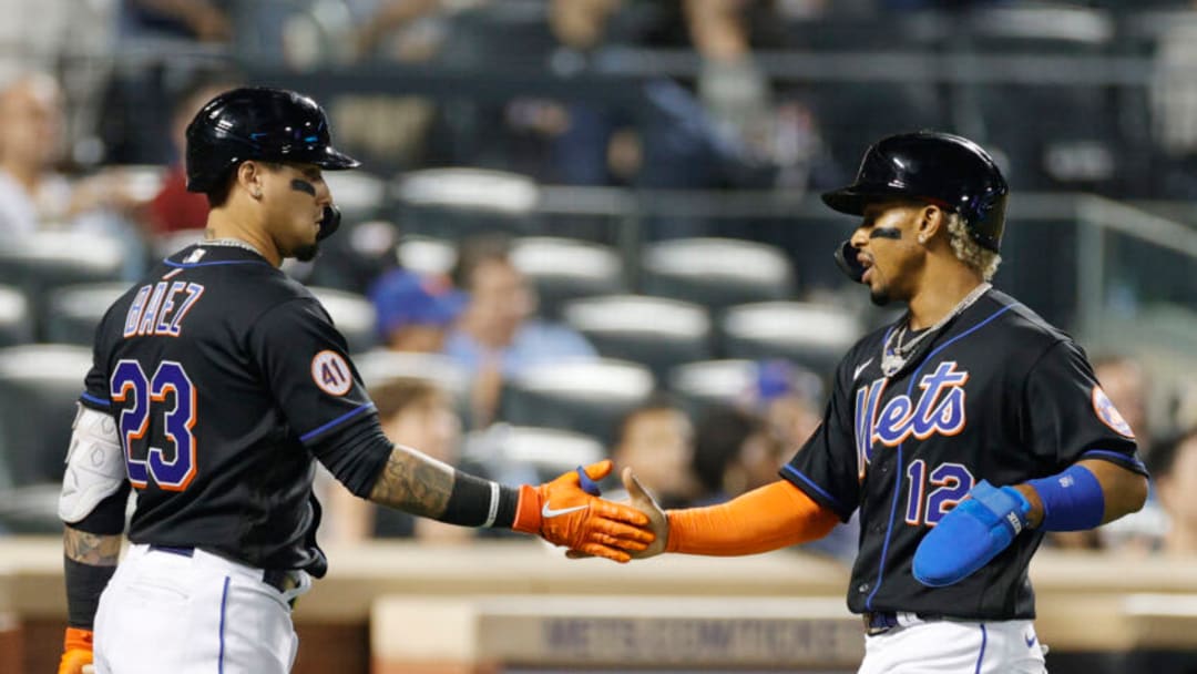 NEW YORK, NEW YORK - SEPTEMBER 17: Javier Baez #23 high-fives Francisco Lindor #12 of the New York Mets after Lindor scored on an RBI double hit by Michael Conforto #30 during the eighth inning against the Philadelphia Phillies at Citi Field on September 17, 2021 in the Queens borough of New York City. (Photo by Sarah Stier/Getty Images) NEW YORK, NEW YORK - SEPTEMBER 17: Javier Baez #23 high-fives Francisco Lindor #12 of the New York Mets after Lindor scored on an RBI double hit by Michael Conforto #30 during the eighth inning against the Philadelphia Phillies at Citi Field on September 17, 2021 in the Queens borough of New York City. (Photo by Sarah Stier/Getty Images)
