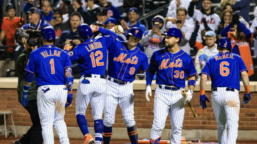 Sep 30, 2021; New York City, New York, USA; New York Mets shortstop Francisco Lindor (12) celebrates his grand slam home run with teammates during the eighth inning against the Miami Marlins at Citi Field. Mandatory Credit: Vincent Carchietta-USA TODAY Sports Sep 30, 2021; New York City, New York, USA; New York Mets shortstop Francisco Lindor (12) celebrates his grand slam home run with teammates during the eighth inning against the Miami Marlins at Citi Field. Mandatory Credit: Vincent Carchietta-USA TODAY Sports