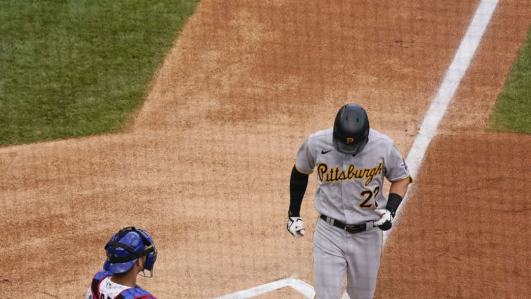 CHICAGO, ILLINOIS - AUGUST 02: Kevin Newman #27 of the Pittsburgh Pirates crosses the home plate past Willson Contreras #40 of the Chicago Cubs following his home run during the first inning at Wrigley Field on August 02, 2020 in Chicago, Illinois. (Photo by Nuccio DiNuzzo/Getty Images)