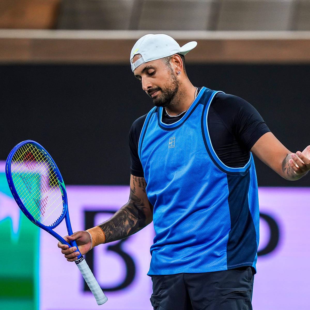Nick Kyrgios struggling with physical fitness during a tennis match