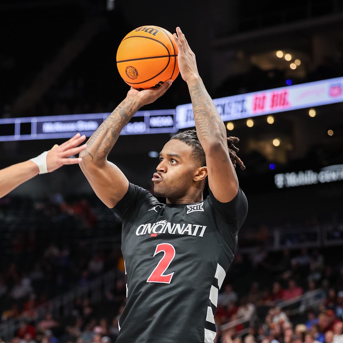 si.com - Russell Heltman - Jizzle James Travels With Cincinnati Bearcats Basketball Team For Georgia Matchup