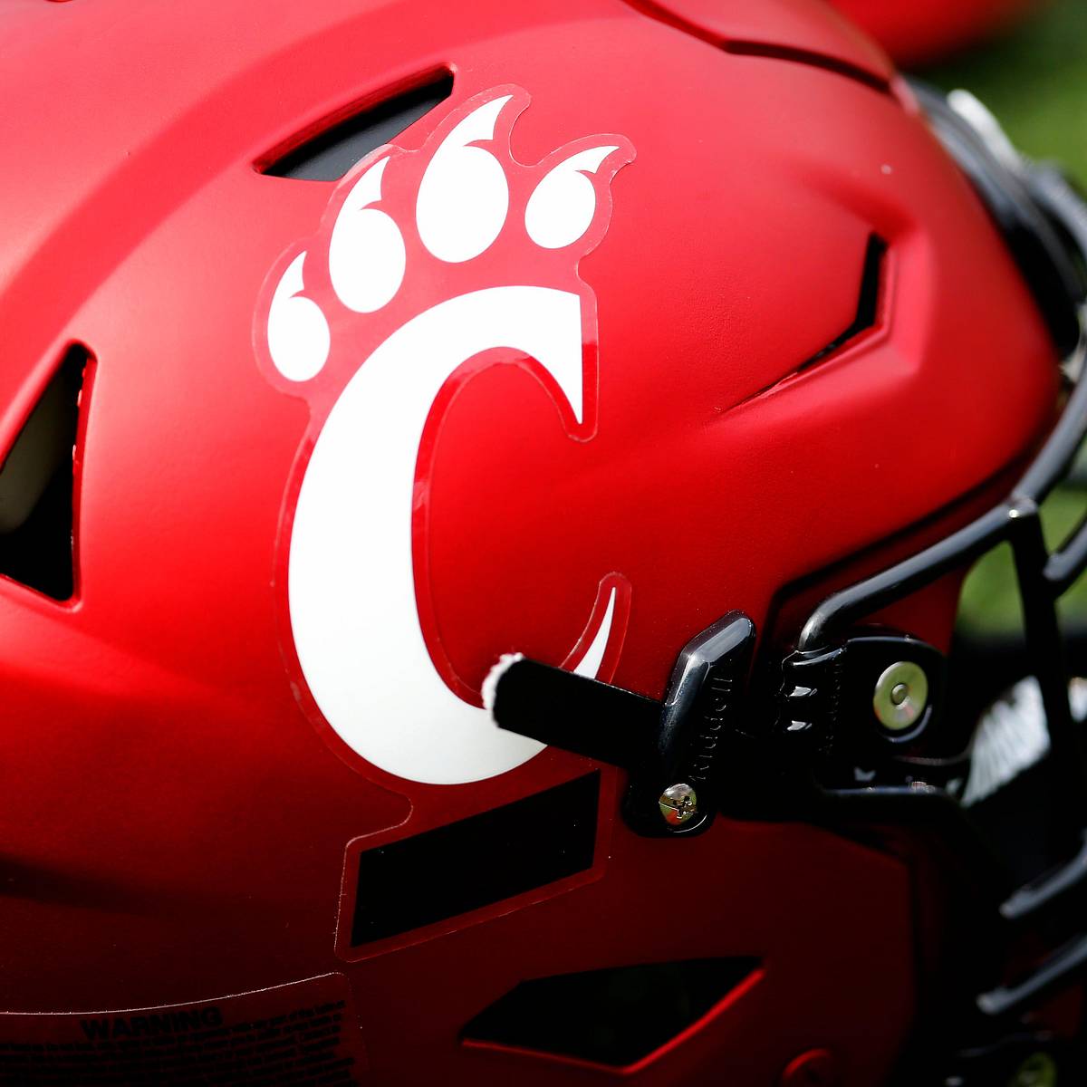 blue football helmet with white number 18 Elite 2027 Linebacker Schedules Official Visit with Duke