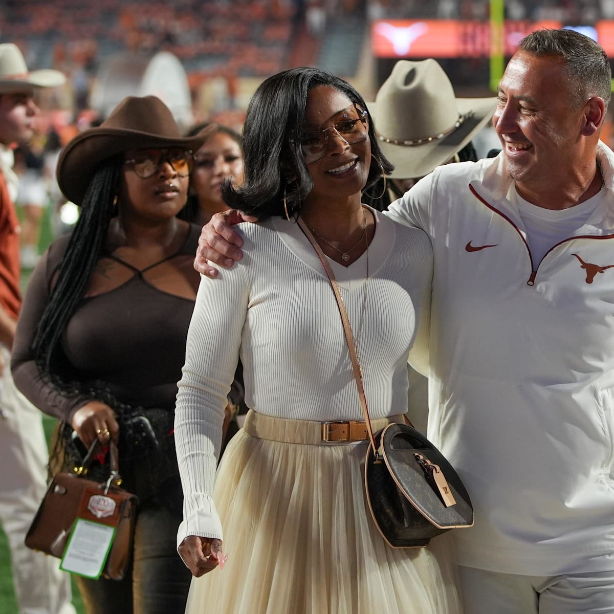 Loreal Sarkisian crushes hubby Steve in amazing Texas burnt orange
