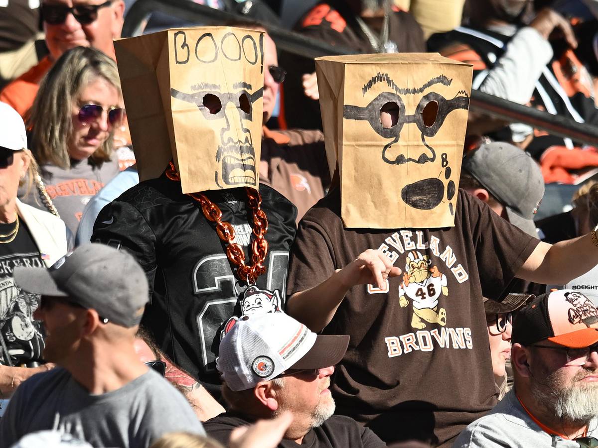 Cleveland Browns supporters wearing paper bags over their heads at a football game