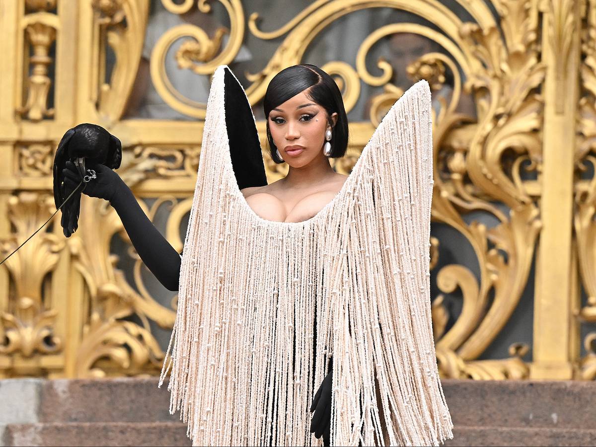 Cardi B Stuns Fans in Paris, Dons Designer Gown With Wild Accessory Cardi B Stuns Fans in Paris, Dons Designer Gown With Wild Accessory