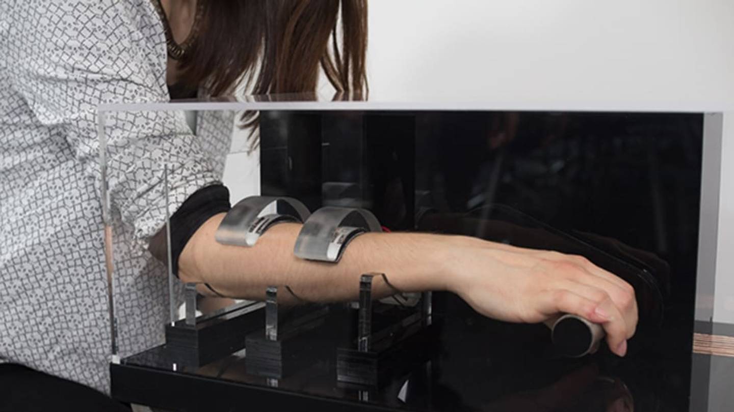 This Art Machine Holds Your Arm Hostage Until Someone Else Puts Theirs In