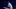 Orel Hershiser of the Los Angeles Dodgers stares at home plate while in the middle of his wind up