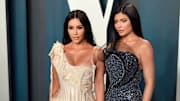 Kim Kardashian and Kylie Jenner at the Vanity Fair Oscars party, joined by family later on