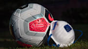 A Premier League Match Ball with a Protective Face Mask