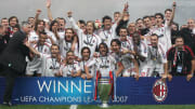 AC Milan's team poses with the trophy  a...