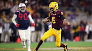 Arizona State quarterback Jayden Daniels runs against Arizona