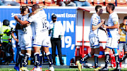 Jugadores del Puebla celebran un gol.