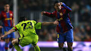 Barcelona's Ronaldinho (R) skips past a