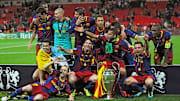 Barcelona's players celebrate with the t