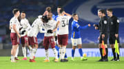 Arsenal's players celebrate at the final whistle