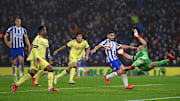 Aaron Ramsdale flings forward to deny Neal Maupay a tap in on a mixed evening for Arsenal's goalkeeper