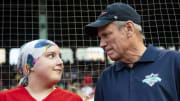 Boston Red Sox Larry Lucchino shares a moment during a game against the Indians