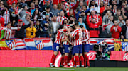Atleti celebrate a goal against Champions League qualification rivals Sevilla