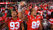 Utah College Football Team Celebrates Win. 
