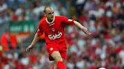 Danny Murphy of Liverpool lays the ball off