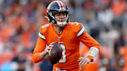 Broncos rookie quarterback Drew Lock dropping back to pass against the Lions in Week 16. 