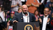 Dana White speaks at a Donald Trump rally.