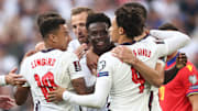 Bukayo Saka celebrates his late headed goal for England