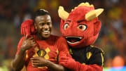 Michy Batshuayi with Red, the Belgium football team's mascot