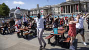England fans celebrate at the Trafalgar Square fan park in London