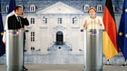 Emmanuel Macron y Angela Merkel