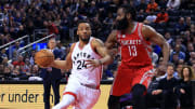 Toronto Raptors wing Norman Powell driving against Houston Rockets guard James Harden