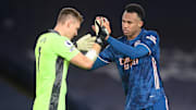 Bernd Leno and Gabriel embrace each other after keeping a clean sheet