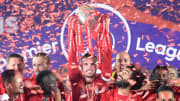 Henderson lifting Liverpool's first Premier League trophy in 30 years.