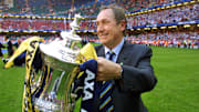 Liverpool's French Manager GTrard Houllier holds t
