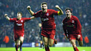 Liverpool's Steven Gerard (c) flanked by