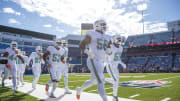 Miami Dolphins defense running out on the field for warmups against the Buffalo Bills