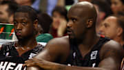 Shaquille O'Neal next to Dwyane Wade on the Miami Heat's bench
