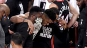 Giannis Antetokounmpo helped off the court during game 4.