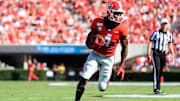 Georgia Bulldog's running back James Cook runs the ball against Murray State