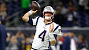 Patriots quarterback Jarrett Stidham cocks his arm back for a pass against the Texans.