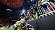 Saints DT Marcus Davenport celebrates with fans